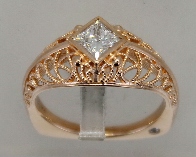 A wide gold ring set with a row of diamonds
