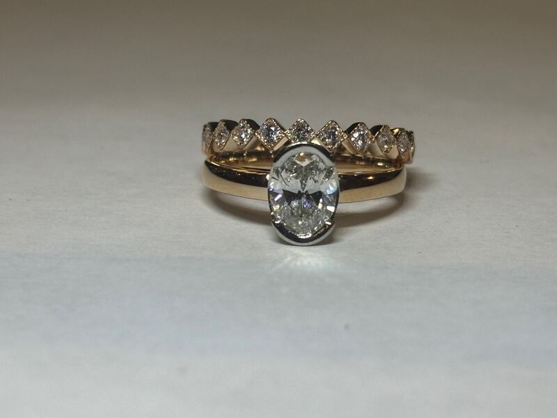 An engagement ring and two matching bands