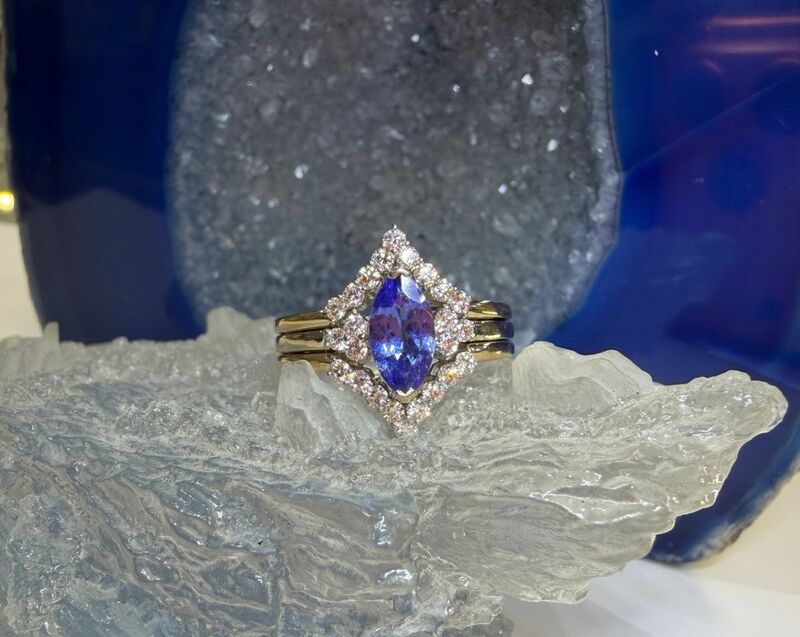 A diamond halo engagement ring in white gold