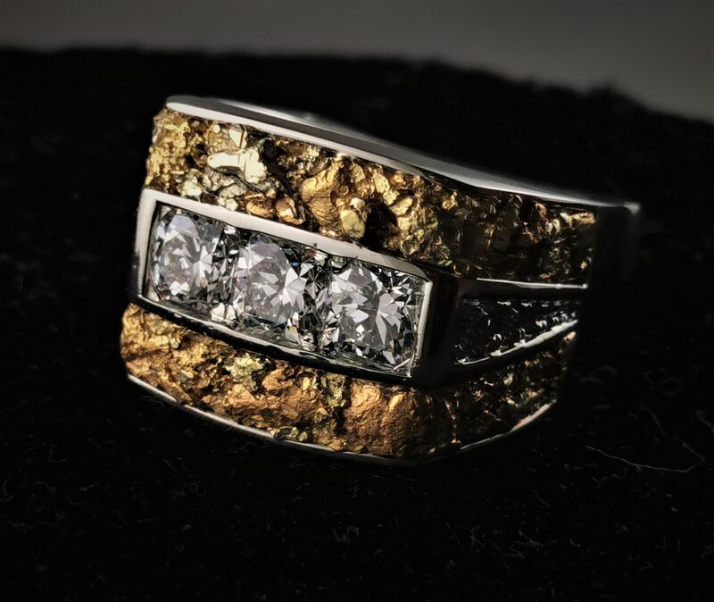 A wide textured gold band set with a row of diamonds