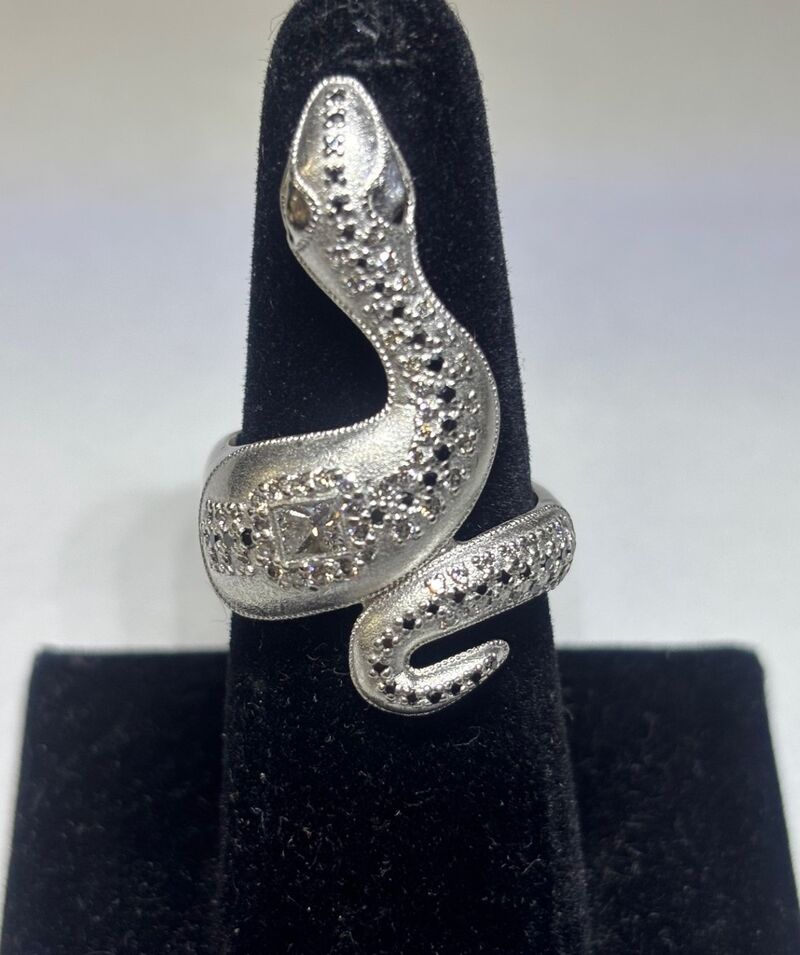 A gold ring set with a ruby and diamonds