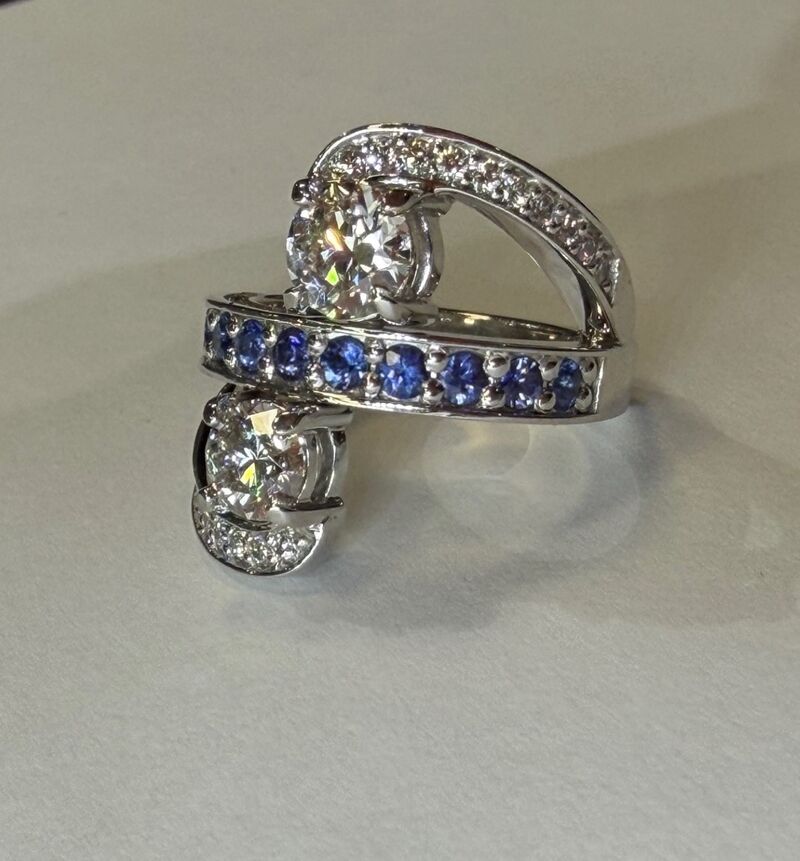 A sapphire ring with a diamond halo and matching band