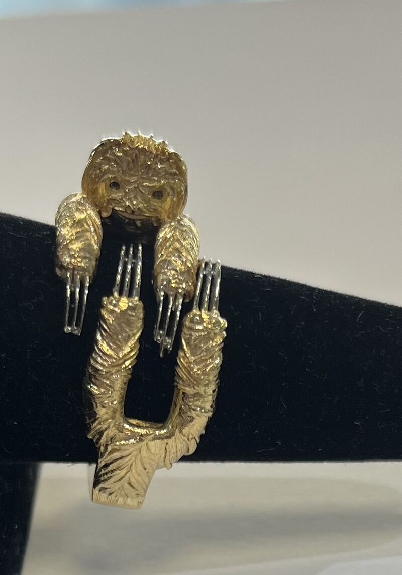 A sculptural gold ring with an organic silhouette