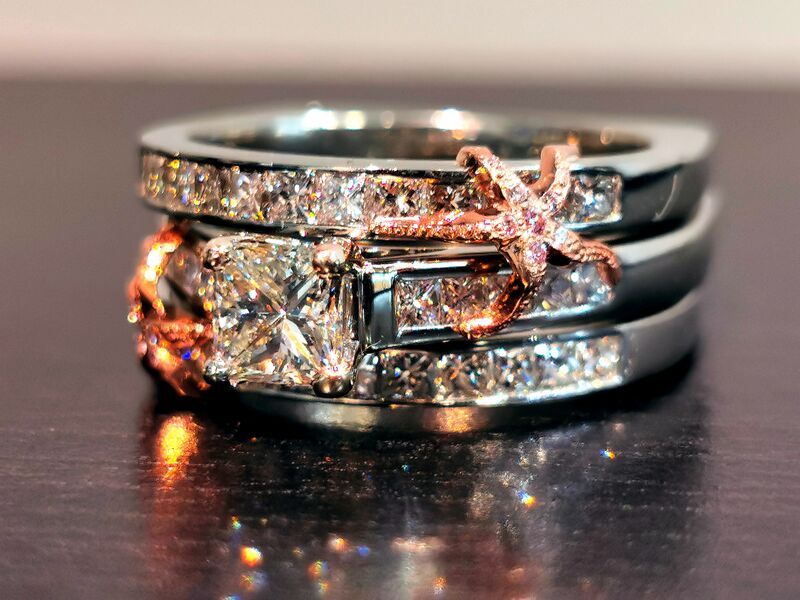 A diamond solitaire ring photographed on dark leather